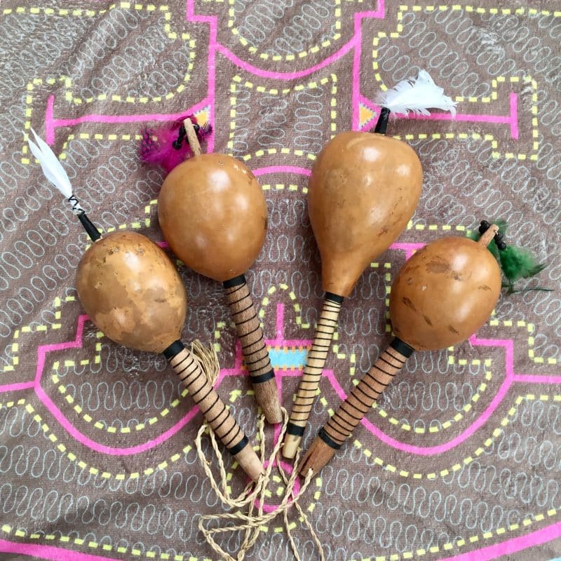 Handmade gourd maracas on Shipibo cloth