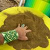 Fresh Kaxinawá rapé powder being prepared by hand in the village