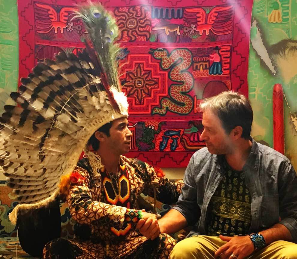 Marcio Purusha — Founder Of Queen Of The Forest 1 Marcio Purusha — Founder Of Queen Of The Forest Marcio Purusha in dialogue with Yharu Kuntanawa wearing a traditional feather headdress